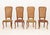 Set of Five Italian Provincial Style Cane-Paneled Walnut Dining Chairs, four side chairs and one armchair, each with high...