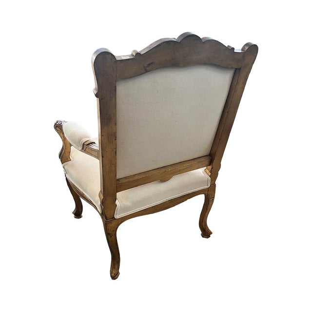 These beautiful gilt wood armchairs have stunning, ornately carved details throughout, including cabriole legs. They have...