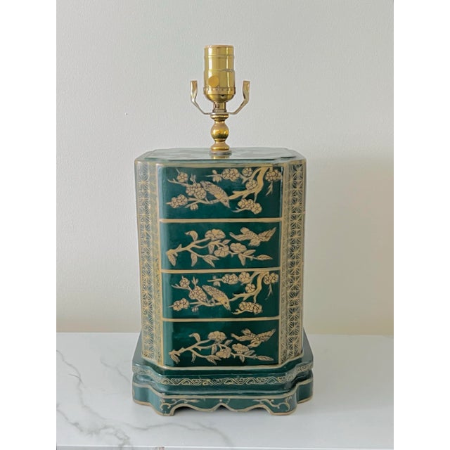 A vintage Hollywood Regency Chinoiserie style table lamp in the form of a traditional tea canister. Finished in deep green...
