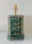A vintage Hollywood Regency Chinoiserie style table lamp in the form of a traditional tea canister. Finished in deep green...