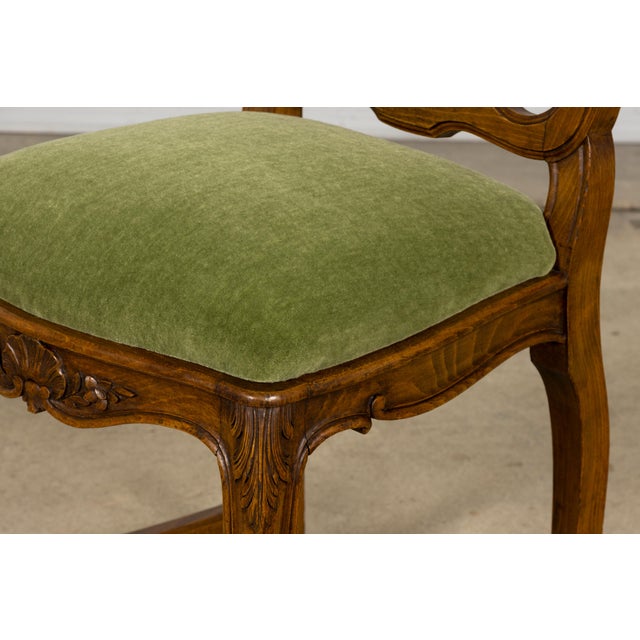 A beautiful set of eight Early 20th Century French Louis XV dining chairs sourced in Provence, France. Crafted from solid...
