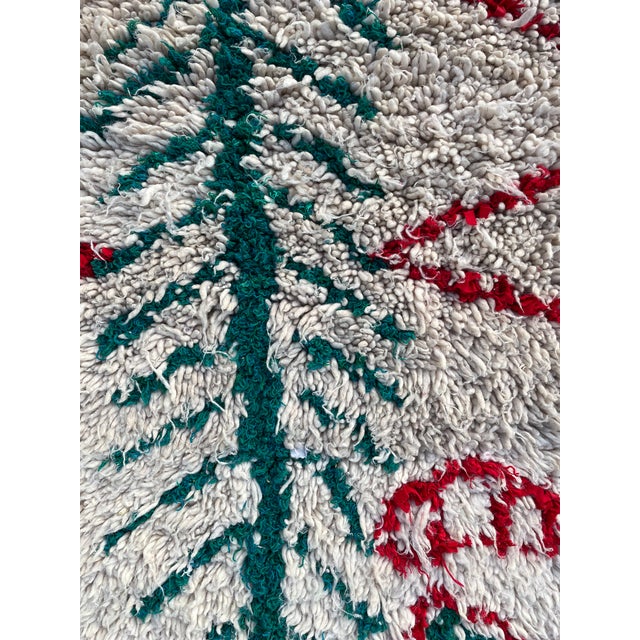 Hand-woven by the Berber women in the Atlas Mountains, this Vintage rug is created with soft natural wool fibers from the...