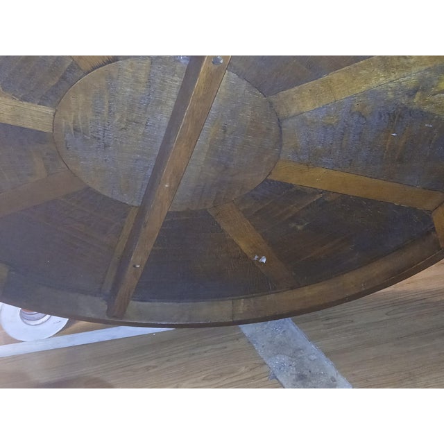 Gorgeous Oak coffee table with pie shaped sections and an inlaid compass rose. There are barley twist legs, three of them....