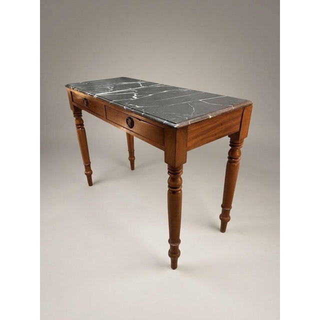 This exquisite 19th-century antique side table combines classic craftsmanship with timeless elegance, featuring rich...