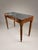 This exquisite 19th-century antique side table combines classic craftsmanship with timeless elegance, featuring rich...