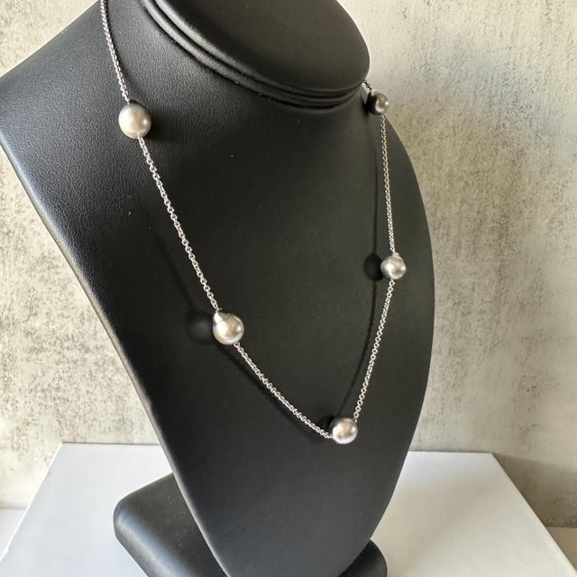 Elevate your collection with this elegant Pearl Necklace in 14k White Gold. Featuring lustrous gray pearls, this necklace...