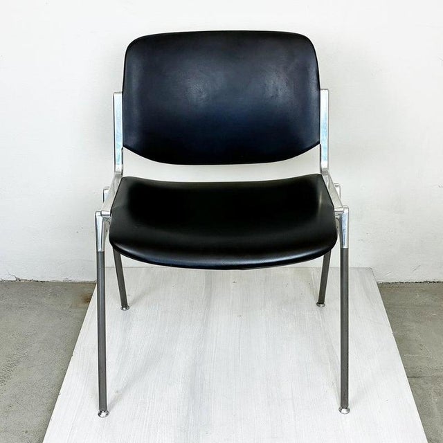This iconic Italian Midcentury Modern DSC 106 stacking chair was designed 1965 by Giancarlo Piretti for Castelli Italy. It...