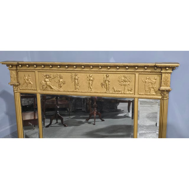 A very nice tryptich Regency gilt overmantle mirror, bevelled plates, in overall very good condition. 39" high 54.5" wide...