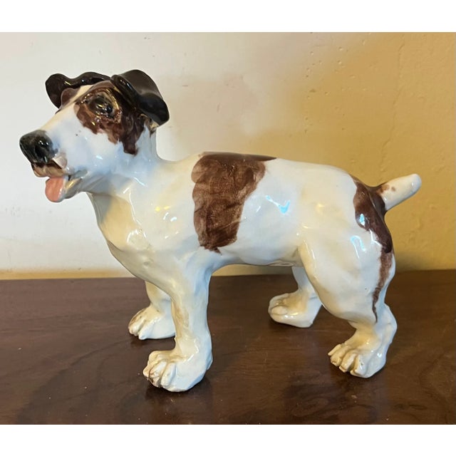 Pottery dog sculpture of a Jack Russell terrier. Beautifully captures the essence of this breed. Measures 7" x 3" x 5 3/8"...