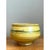 This earthenware bowl commands attention through its confident, rounded silhouette and the horizontal banding that wraps...