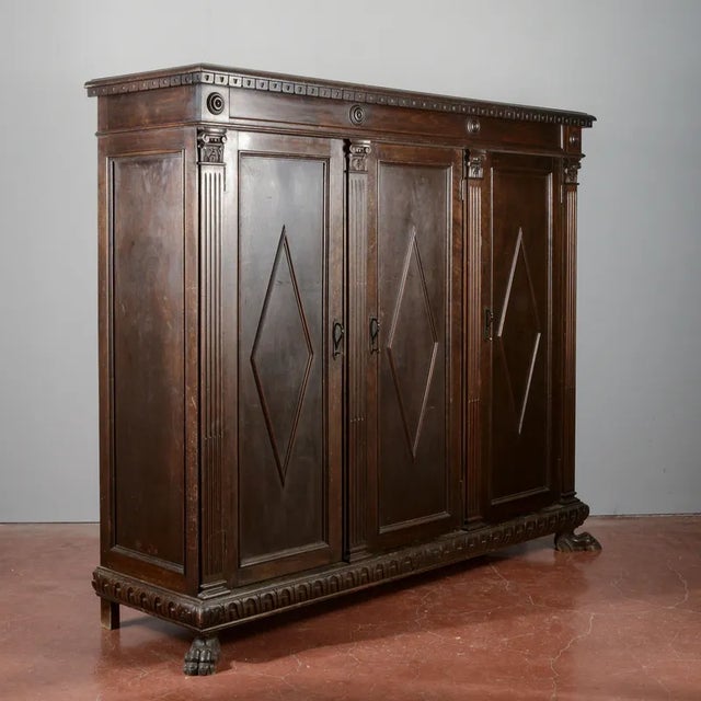 Three-door sideboard from the early 1900s with neo-renaissance style diamond decorations and animal paw foot. Built with...