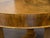 An Austrian Biedermeier period walnut center table from the mid 19th century, with butterfly veneered top, tripod base and...
