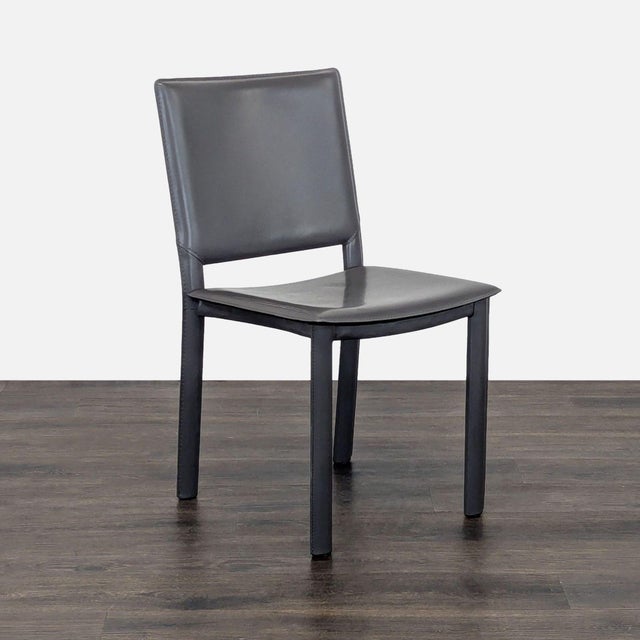 Designed by Maria Yee, the Madrid Chair features bonded leather-wrapped steel construction. Brand: Room & Board. Original...
