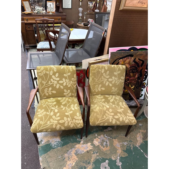 Fantastic pair of original 1950s Sculptural Danish Modern Lounge Chairs. Each are comprised of solid wood frames with...