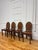 A set of four 18th century English George III hall chairs in solid mahogany that has a warm, even tone with visible wear...