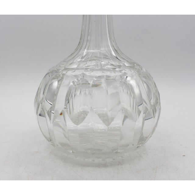 Anglo-Irish round, slender neck decanter with stopper, circa 1880. Handblown & cut. Panelled neck & shoulders; round base...