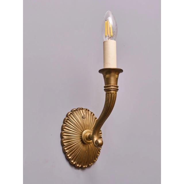 Brass single-arm lamps with discreet decoration. The lamps are of high quality - solid brass design. The lamps have...