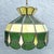 Charming vintage Mid-Century Modern stained glass pendant light featuring a geometric shade in layered shades of green,...