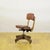 This refined vintage chair is an excellent example of early 20th-century professional furniture. Featuring a solid wooden...