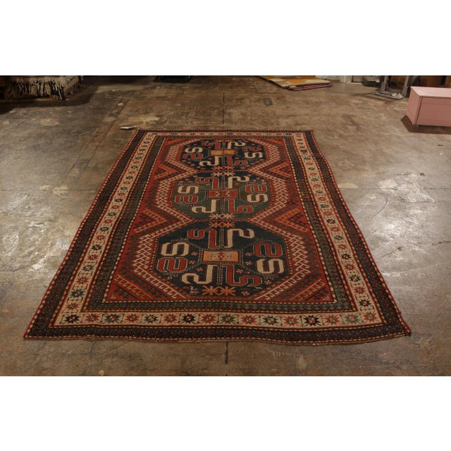 While this hand-knotted wool antique rug originates from Russia circa 1910-1920, the Kasai rug design draws its name from...