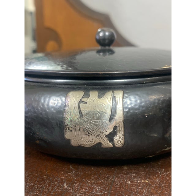 This striking vintage trinket box is expertly crafted from hand-hammered copper and embellished with applied sterling...