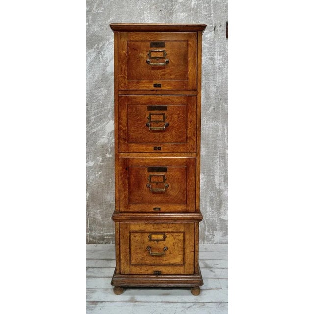 A superb large oak filing cabinet. Made from oak with 4 full length drawers each with a brass pull handle and fittings,...
