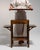 This 1910s Art Deco side table from France is finished in brown, worked in wood. Its design carries the Art Deco idiom...
