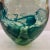 Thick heavy glass vessel or vasel by Artists Choice Kosta Boda. There are a lot of bubble inclusions and within the green...
