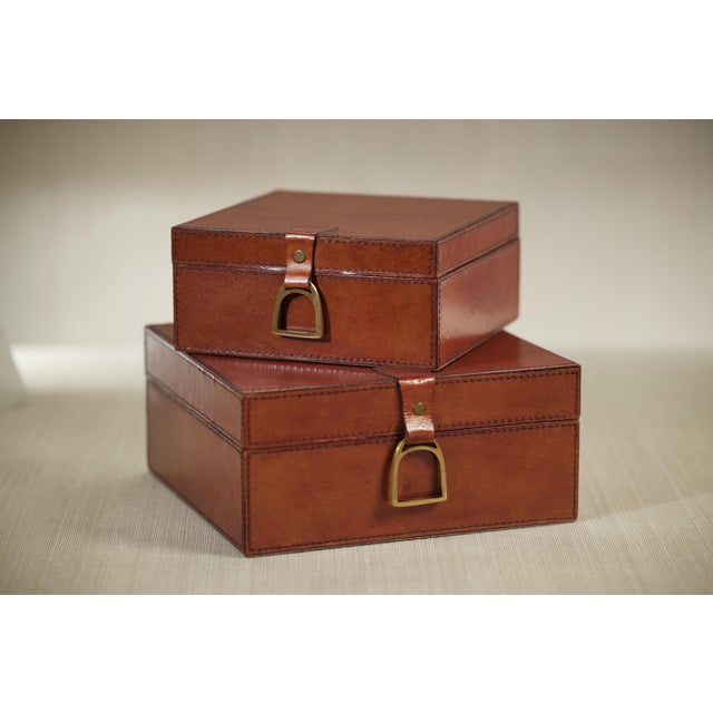 A beautiful decorative box made of leather with bold stitching that would render sophisticated look to your home...