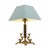 Classic vintage brass table lamp, a square brass base with a central column, along the sides two mythical fish or dolphins...