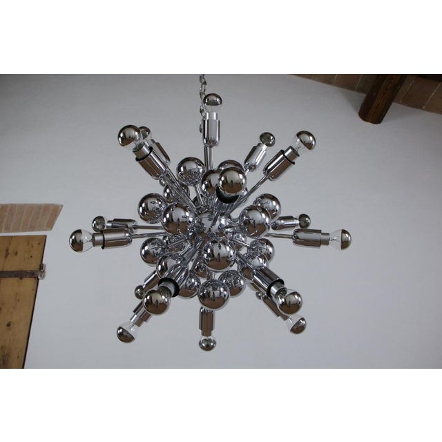 A magnificent italian midcentury, specifically space age, chandelier designed by goffredo reggiani in the 60s and 70s....