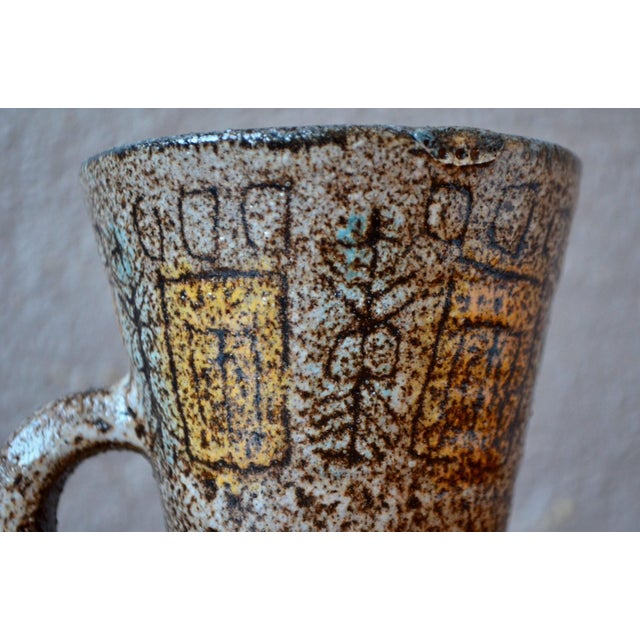 This lovely vase or cup, with its generously open shape, is a product of the Accolay potters. The ceramic is decorated...