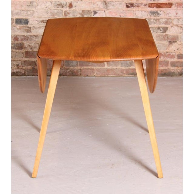 Mid Century Ercol drop-leaf beech dining table, circa 1960s. Excellent fully restored condition. H: 72cm W: 65cm - 95cm -...