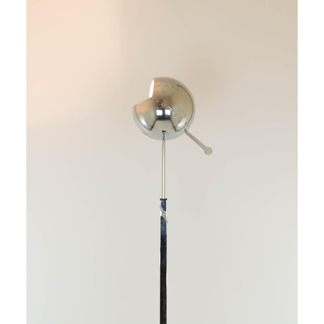 Fire Ball floor lamp designed by Carlo Forcolini and manufactured by Artemide for Sidecar. The lamp has a flat square...