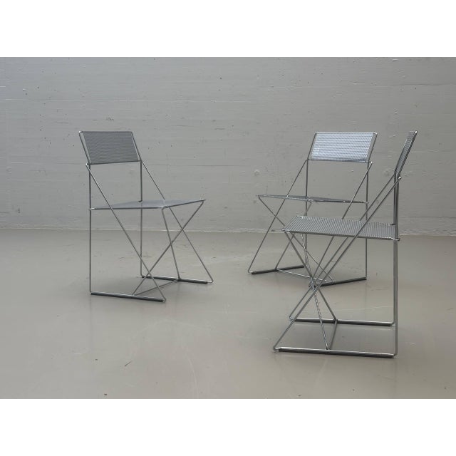 Iconic x-line chairs by danish designer niels jørgen haugesen, designed in the late 1970s. The design exemplifies...