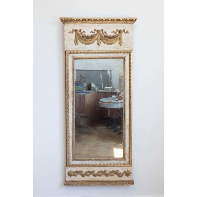 A Swedish period Gustavian painted and gilt trumeau mirror from the late 18th century with original paint and original...