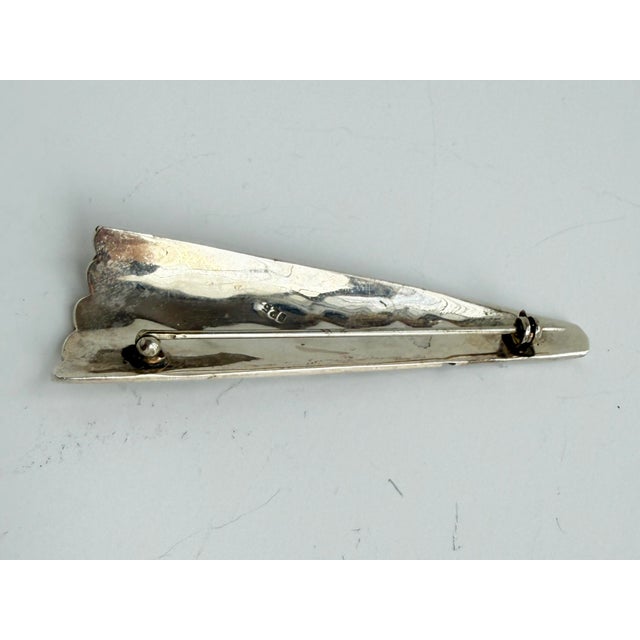 A cool brushed sterling brooch with carved geometric designs. Stamped 925.