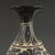 Striking pear-shaped Yuhuchun vase hand-carved with scrolling floral motifs in deep black slip against a warm cream...