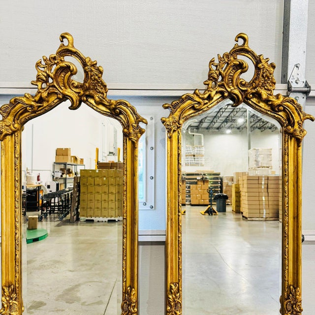 Fall in love with the refined elegance of this French style gold leaf floor mirror set, featuring 2 stunning mirrors that...