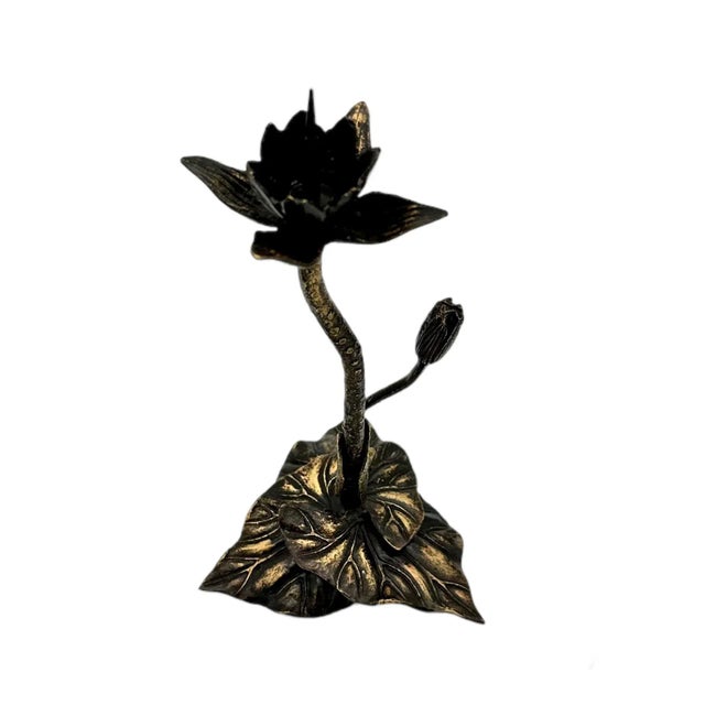 This antique candle holder is a beautiful piece of art that will add a touch of elegance to any room. The candlestick...