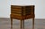 A small English Victorian period faux book trunk on base from the 19th century with cylindrical tapering legs. This...