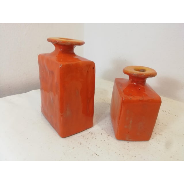 Ceramic bottles decorated with a double fire in orange. Truly beautiful and intense colors. Essential yet highly...