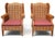 An exceptional pair of vintage Palecek lounge chairs showcasing a dramatic wingback silhouette executed entirely in...