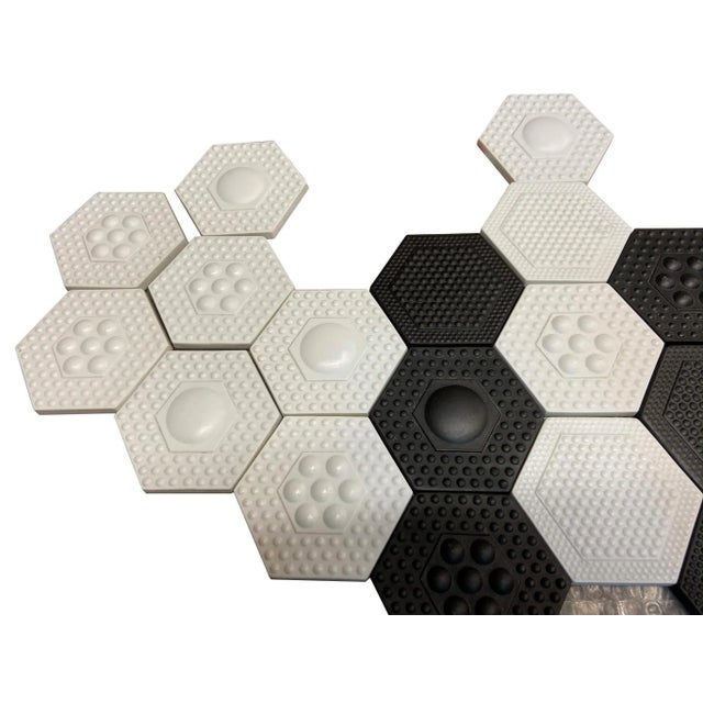 Group of 48 Rosenthal tiles, 25 in black biscuit porcelain and 23 in white biscuit porcelain, Studio Linie collection....