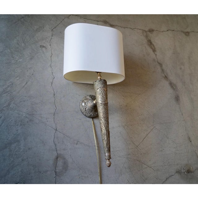 Antique sconce lamp for sale. Made of silver, and in great working condition. Very beautiful detailing on the body with...