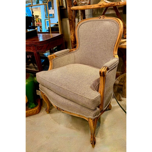 This is a classic pair of early 20th century carved Louis XV style begeres in the manner of Etienne Meunier. The bergeres...