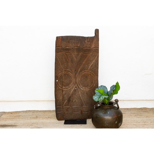 Carved from heavy hardwood in southeastern Nigeria, this door continues the deep relief tradition of Igbo carved doors and...