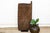 Carved from heavy hardwood in southeastern Nigeria, this door continues the deep relief tradition of Igbo carved doors and...