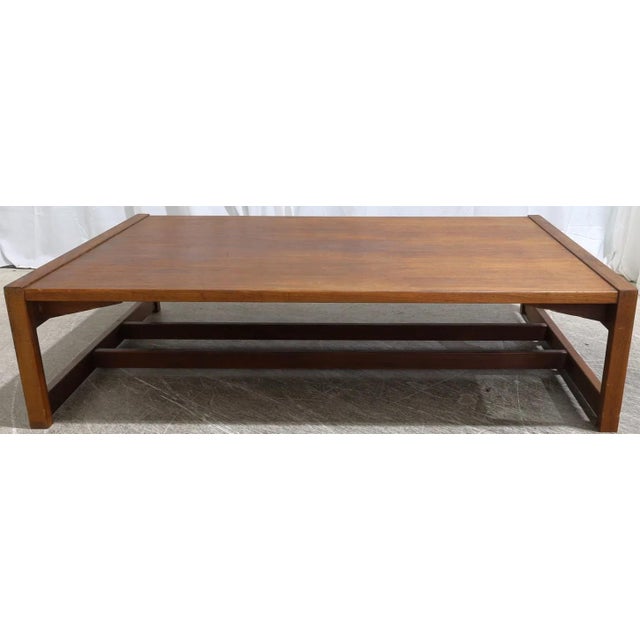 A quintessential mid century modern design courtesy of Jens Risom. This large walnut coffee table is perfect for a large...