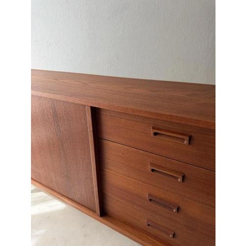This Mid-century sideboard from the 1960s possesses exactly the proportions that make a good design so serene. with a...